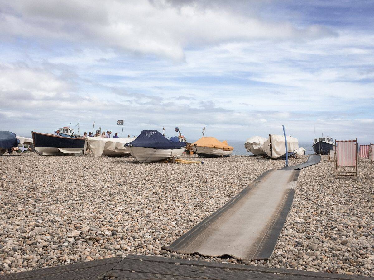 Boats on the pebbles at Beer