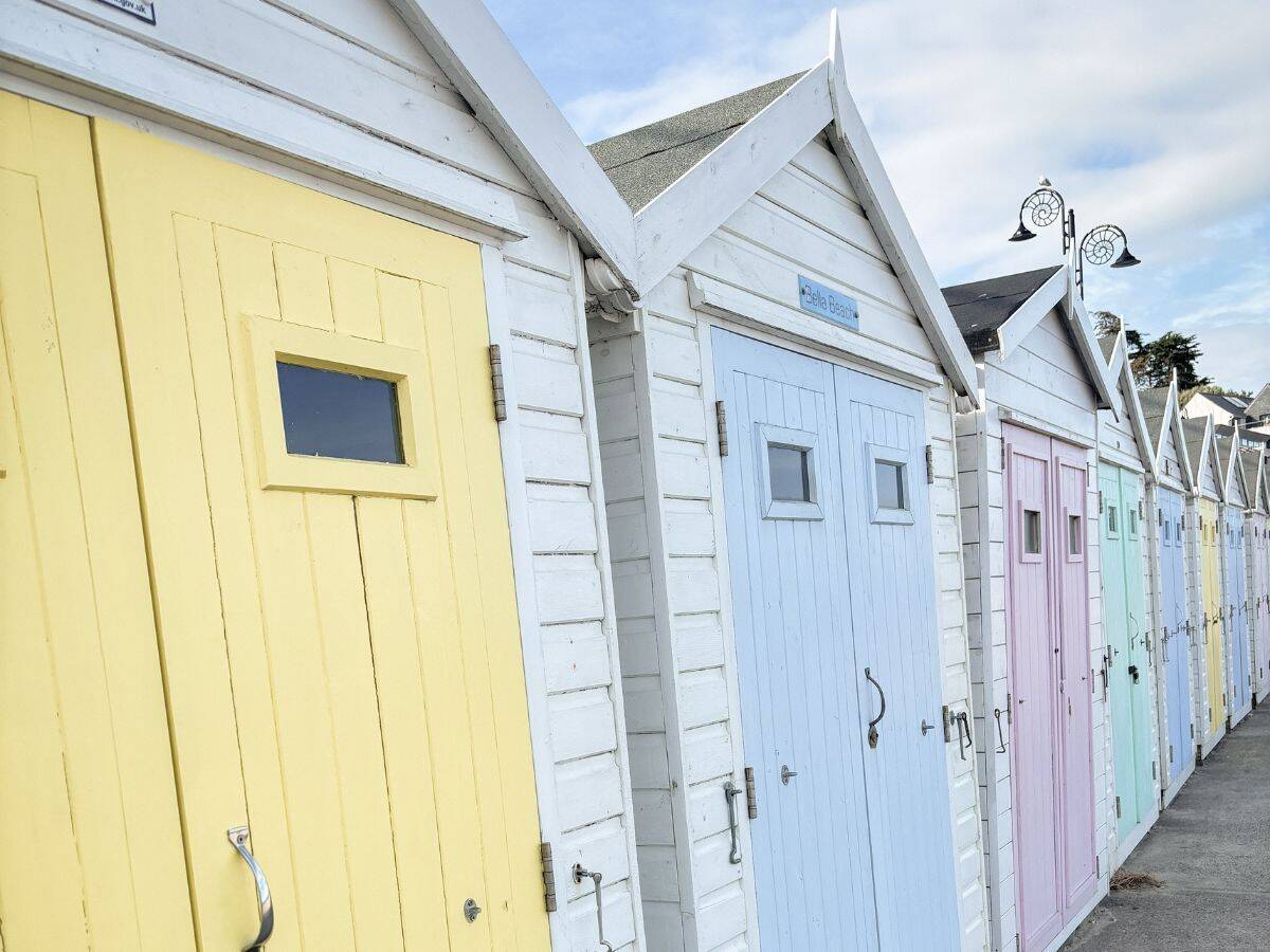 Beach huts on the seafront at Lyme Regis, perfect for using during a weekend break