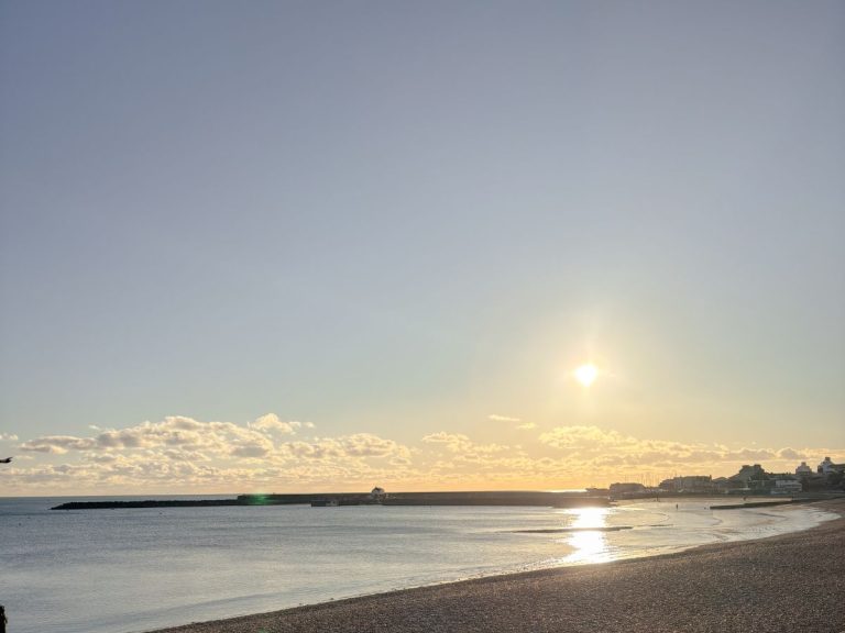 The sun setting on a winter's day over Lyme Regis Bay