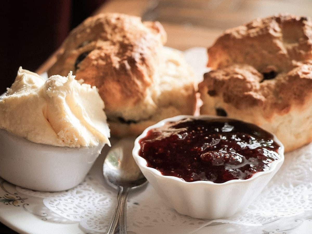 Scones with jam and cream ready to serve