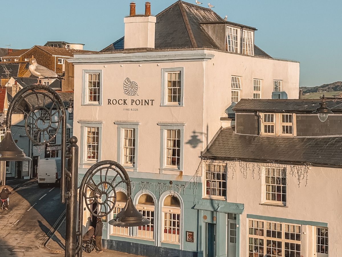 The Rock Point Inn in Lyme Regis under a setting winter sun