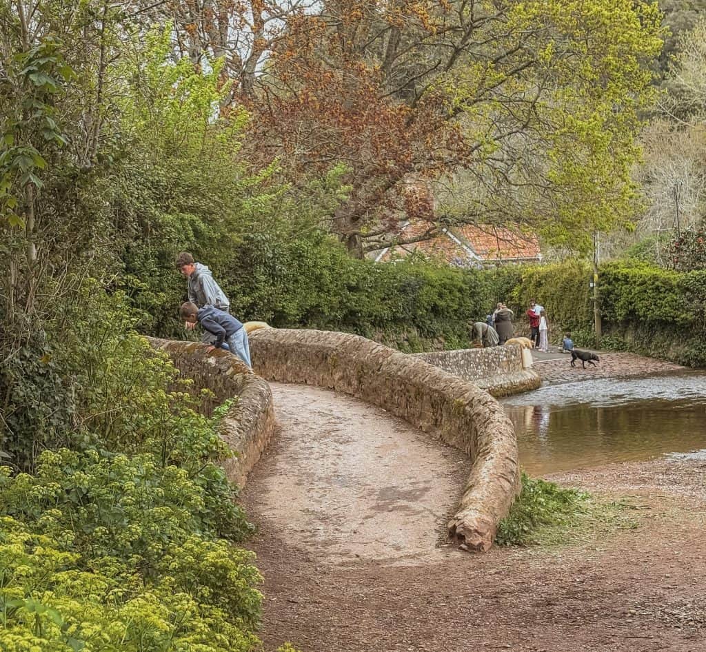 Beautiful bridge in Dunster with stream