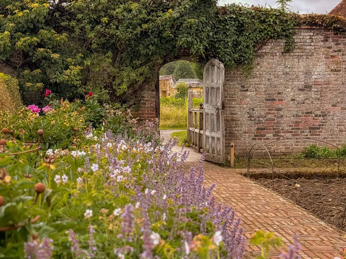 The beautiful gardens and textured gate at Barrington Court in Somerset