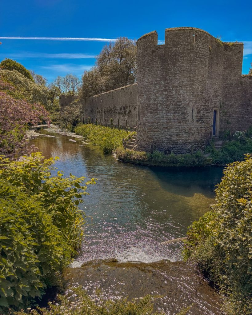 The beautiful waterfall and pond at Bishop's Palace Gardens, Wells in Somerset