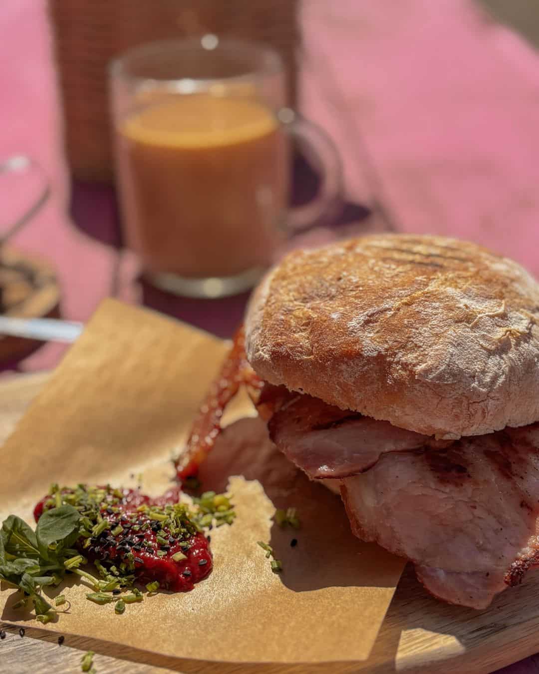 A delightful bacon bap while sitting in the sunshine at Loaf, Wells