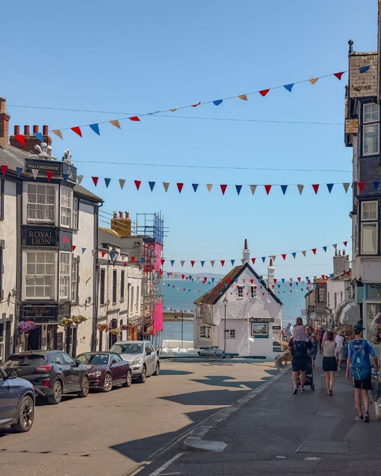 Lyme Regis high street with bunting in the summer sun
