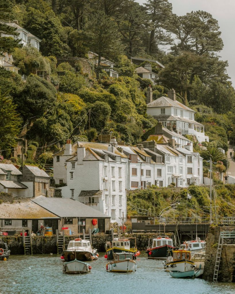 Boats and houses on the hill in Polperro, Cornwall